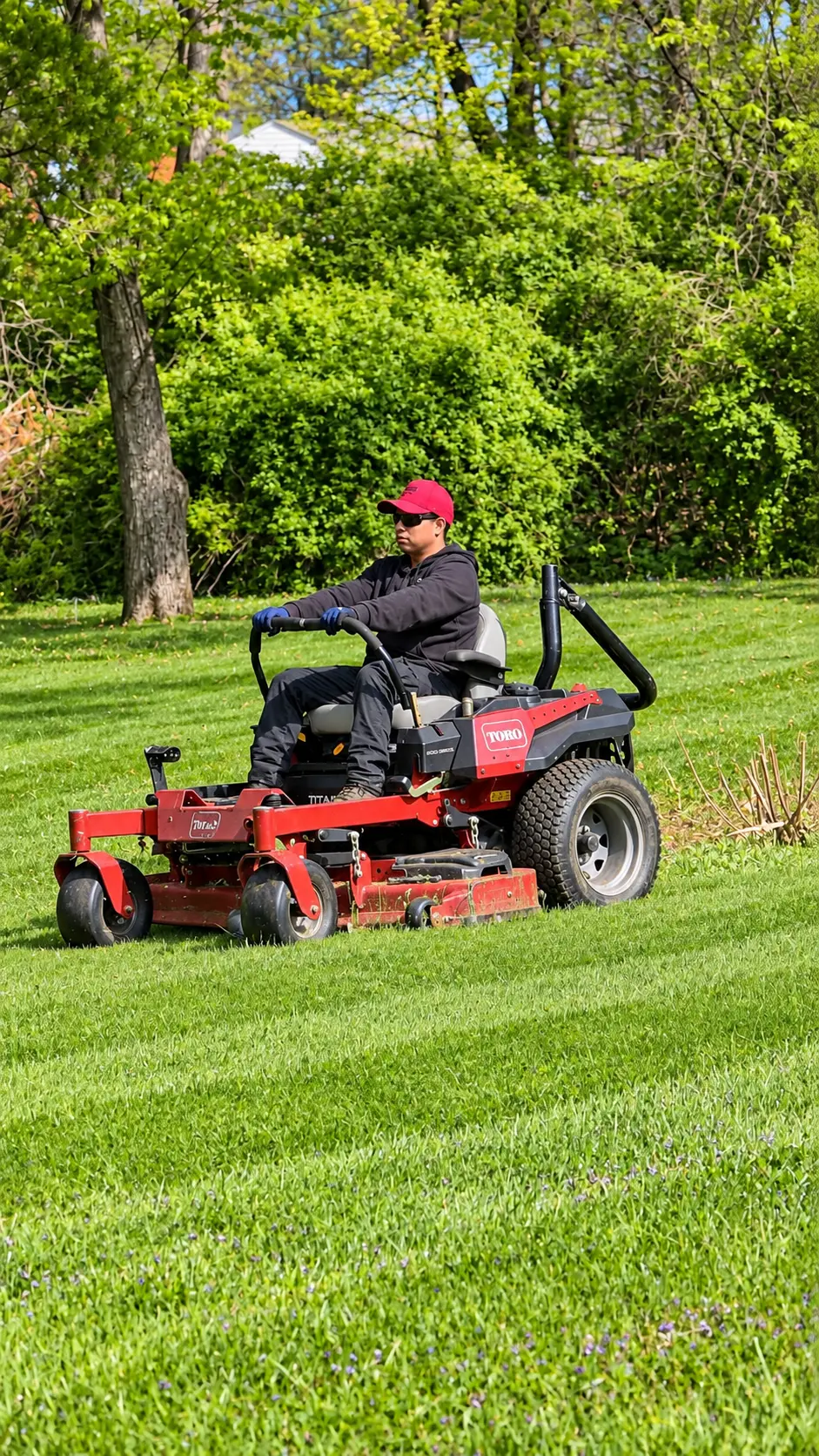 Zero turn mower cutting a large backyard lawn in Somerset County, New Jersey